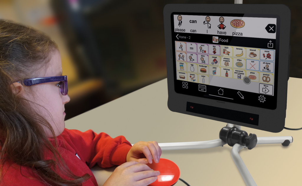 Young girl in glasses sits looking at a Skyle device - Focus Disability Services