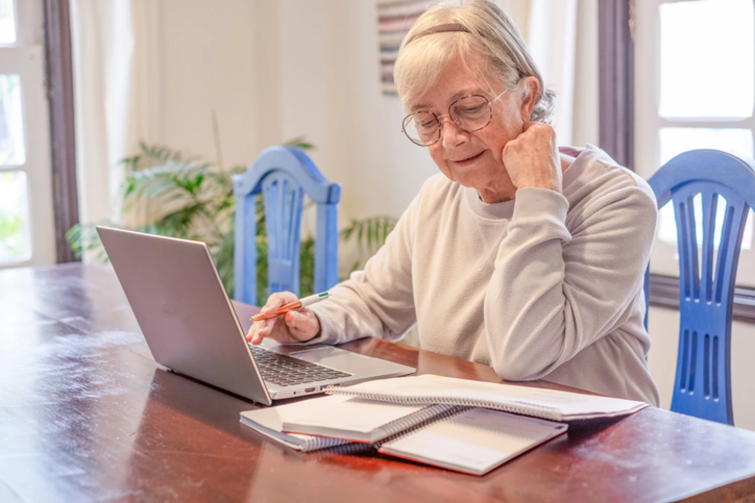 Senior woman working out budget for Level 2 Home Care Package.