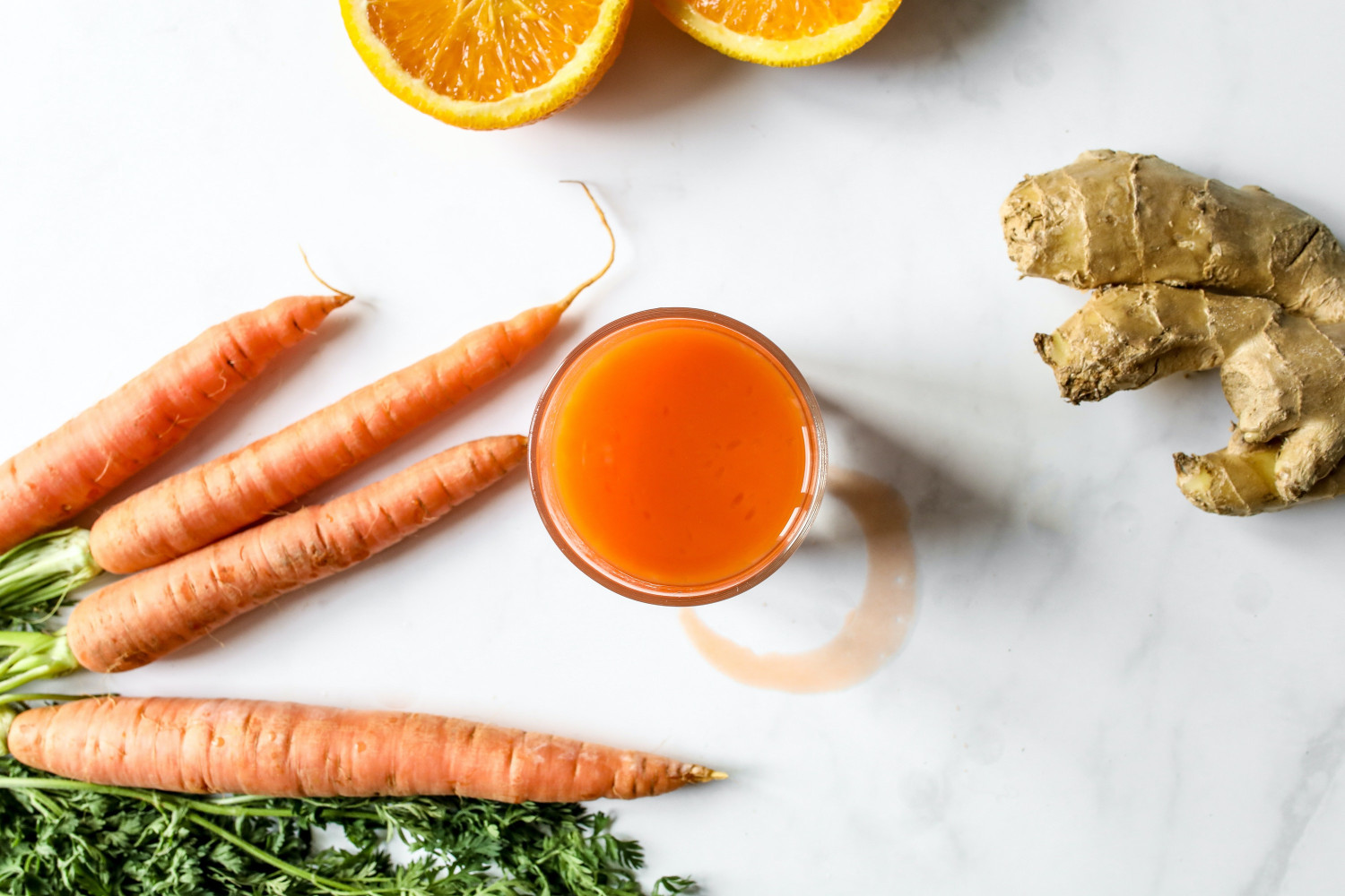 A cup of carrot and ginger juice, carrots, and ginger - Healthy Food Options for Seniors - Focus Care
