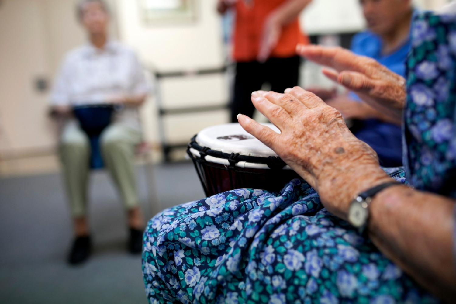 Older woman doing Music Therapy in aged care setting