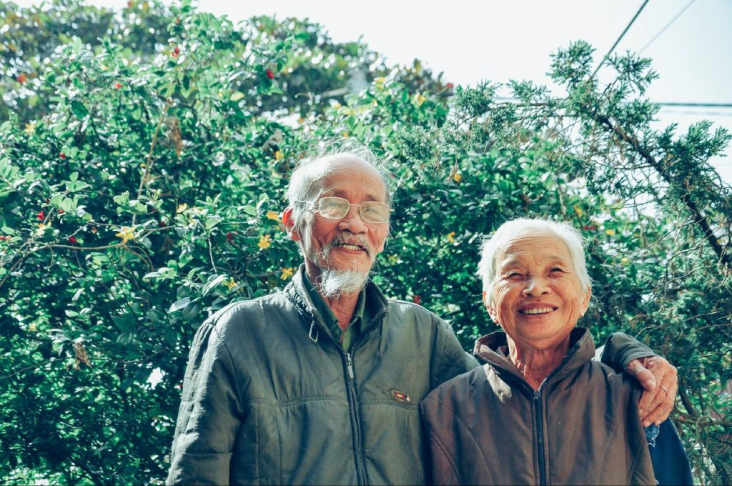 Elderly couple walking in nature. Exercise for arthritis - Focus Care