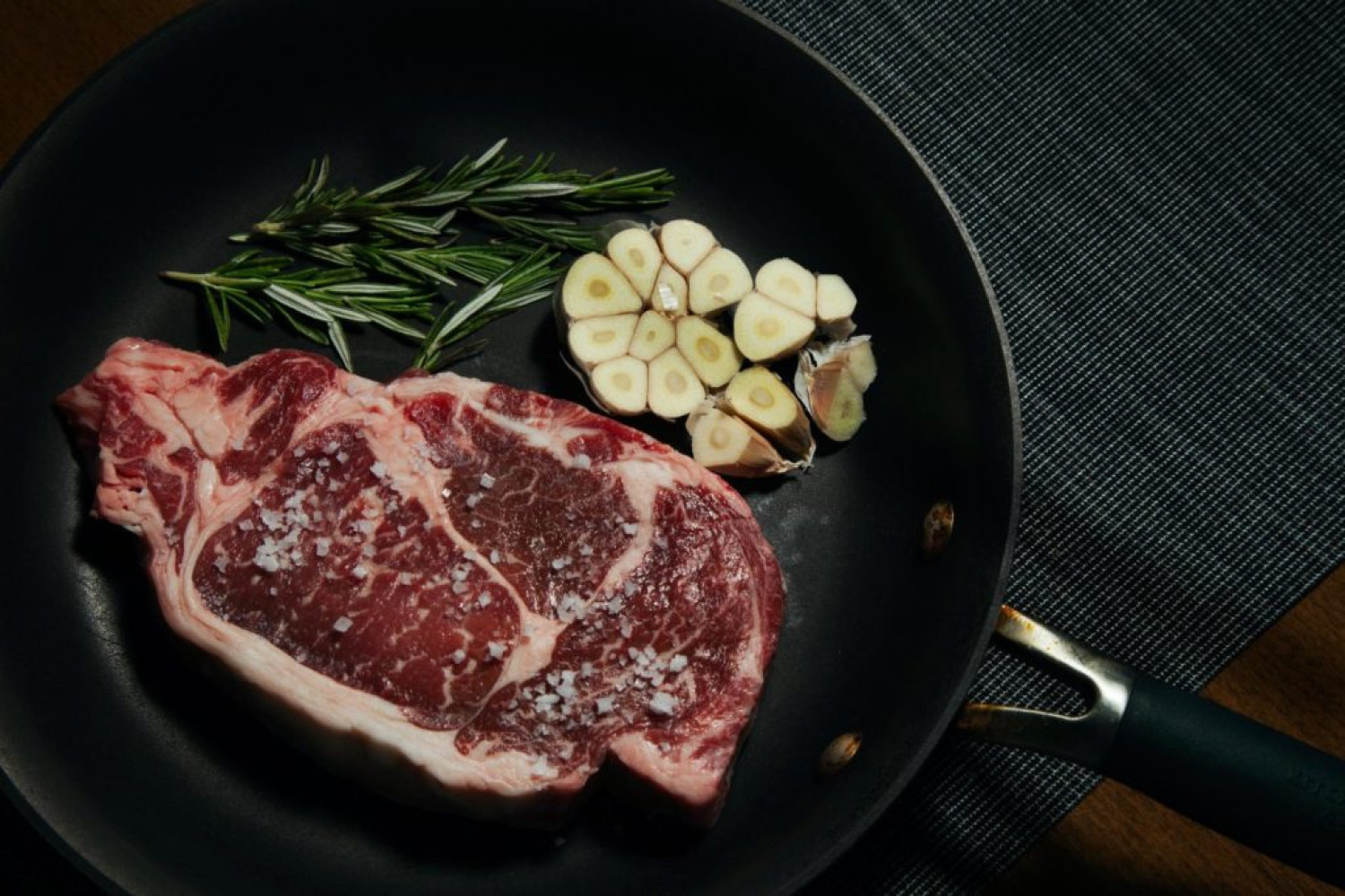 Steak, garlic & rosemary in a pan - Virtual dinner party - Celebrating during Covid19 lockdown