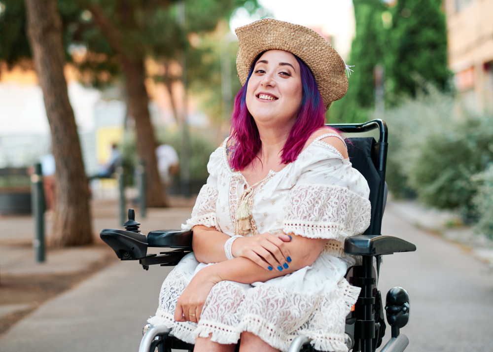 A woman in a wheelchair who is receiving funding from the NDIS - Focus Care
