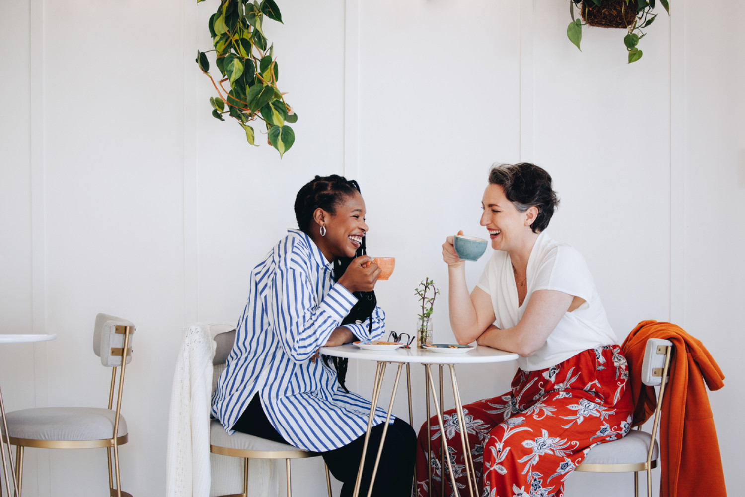 Two women who are neurodiverse meeting in a cafe