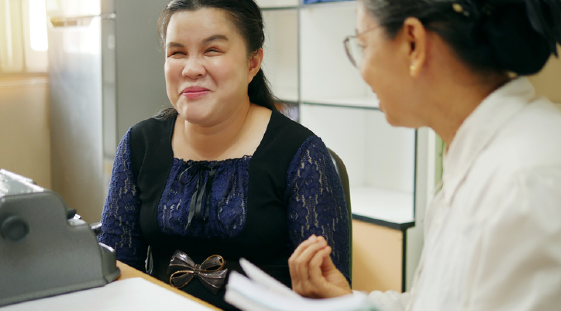 Blind asian woman participating in work as part of the NDIS checklist